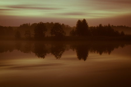 Early autumn sunrise on the river. tintedの写真素材