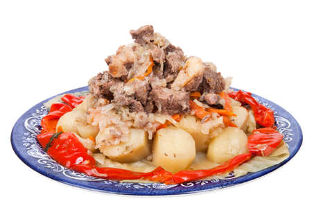 Stew with potatoes sweet pepper on a plate isolated on white backgroundの写真素材