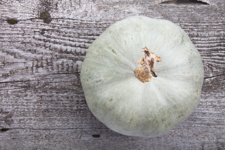 autumn background with pumpkin on wooden boardの写真素材