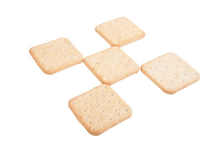 Biscuits lined checkered isolated on white backgroundの写真素材