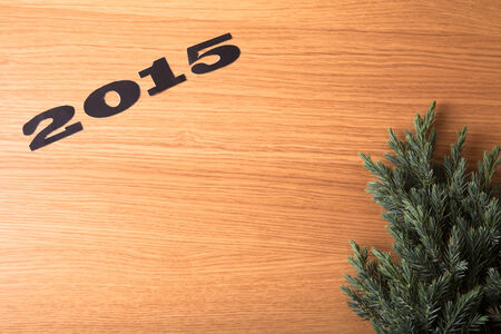 Inscription 2015, Christmas tree on a wooden tableの写真素材