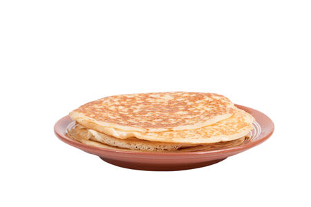 Russian traditional yeast crepes lying in the ceramic dish. Shallow depth of fieldの写真素材