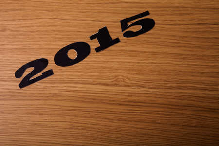 Inscription 2015 on flour on a wooden table