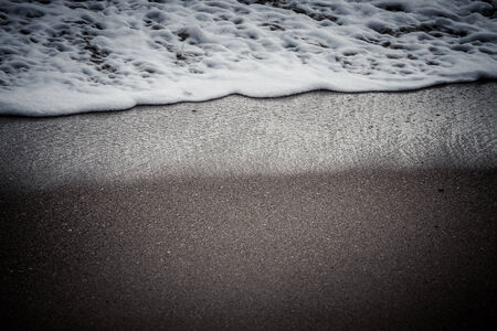 Soft wave of the sea on the sandy beachの写真素材