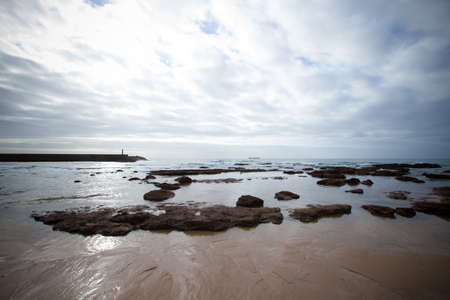 dramatic Atlantic coast at low tide.の写真素材