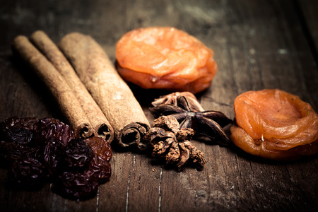 cinnamon, raisins, dried apricots on a wooden table.Shallow depth of fieldの写真素材