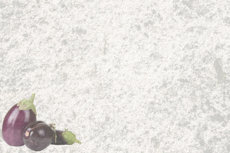 Textured old stone with three eggplantの写真素材