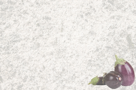 Textured old stone with three eggplantの写真素材