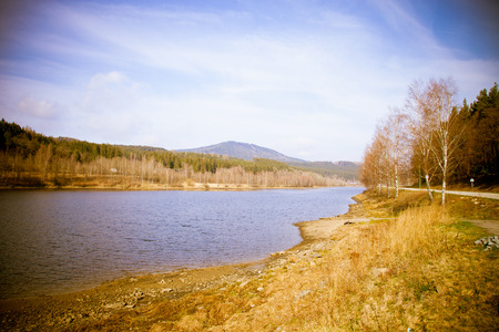 Autumn Mountain with lake view and foliage in forest.の写真素材