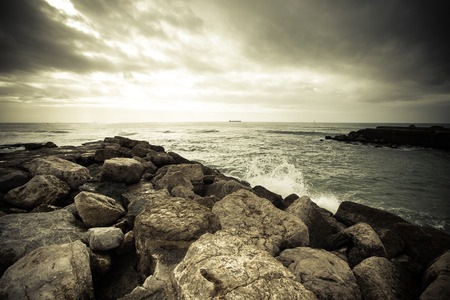 In anticipation of the storm. Dramatic sky on the stone coast of the Atlantic Oceanの写真素材