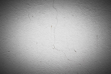 Old plastered wall with a crackの写真素材