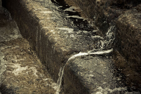 Water flowing down the stairsの写真素材