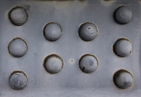Old rusty rivets on large corroding steel plates of a train and auto Bridge. Shallow depth of fieldの写真素材