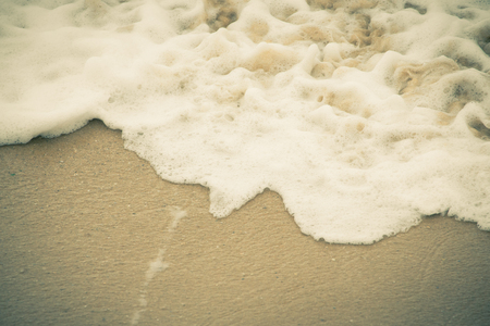 Soft wave of the sea on the sandy beachの写真素材