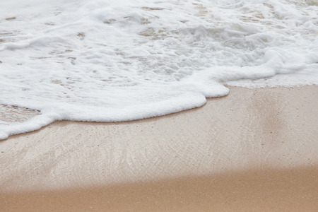 Soft wave of the sea on the sandy beachの写真素材