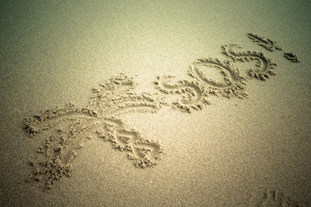 S.O.S written in the sand.Beach background. Top view. tintedの写真素材