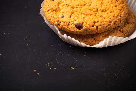 Oat cookies on the old shabby background. tinted