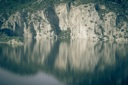 Beautiful cliffs reflected in the lake. Tintedの写真素材