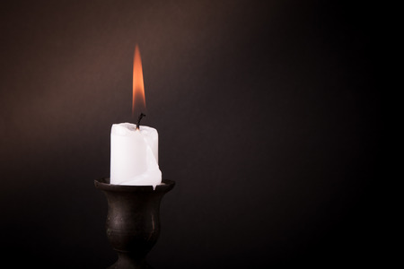 burning candle on a dark background.の写真素材