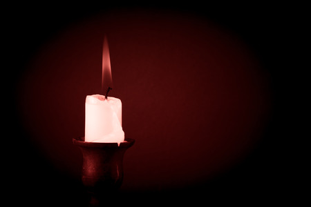 burning candle on a dark background. Tintedの写真素材