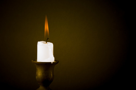 burning candle on a dark background. Tintedの写真素材