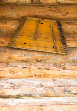 Ancient musical instrument gusli on the wooden floor.の写真素材