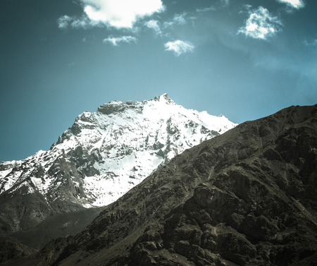 Mountains and clouds on Pamir. Spring. Tajikistan. Toned.の写真素材