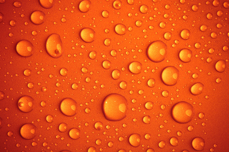 Drops of water on the colored background.の写真素材
