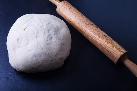 Rolling pin and dough for pie.の写真素材