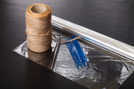 Rope and set for roasting meat on a black background.の写真素材