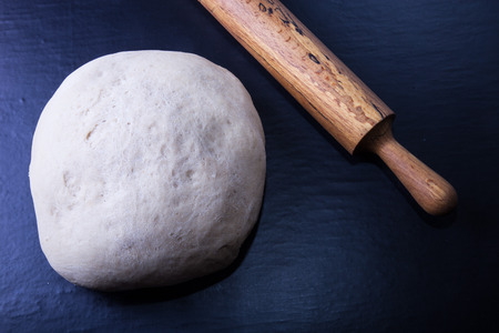Rolling pin and dough for pie. Toned.の写真素材