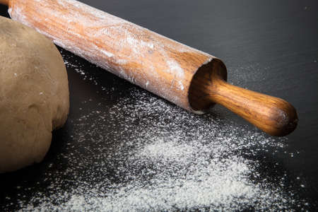 Flour, rolling pin and dough for pie. Toned.の写真素材