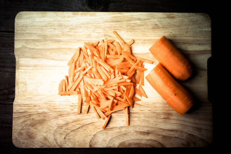 Sliced carrots on a wooden cutting board. Toned.の写真素材