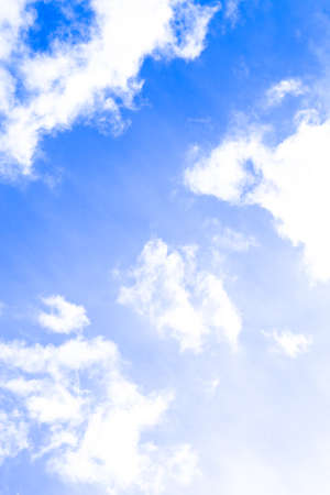 blue sky background with tiny clouds. Tinted. Verticalの写真素材