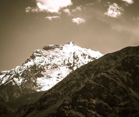 Mountains and clouds on Pamir. Spring. Tajikistan. Toned.の写真素材