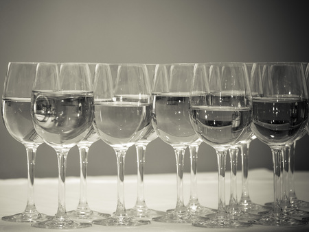 Stemware of champagne on a white table. Banquet. Toned.の写真素材