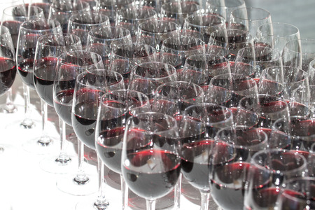 Stemware of red wine on a white table. Banquet.の写真素材