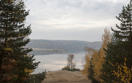 Lake in the forest and beautiful clouds. Landscape.の写真素材