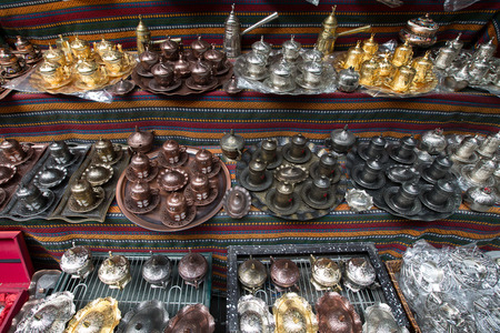 Metal tea and coffee sets on the shelf in the store. Turkey.