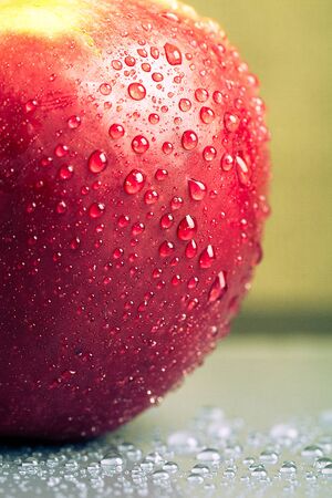 Apple drops on a wet surface. Shallow depth of fieldの写真素材