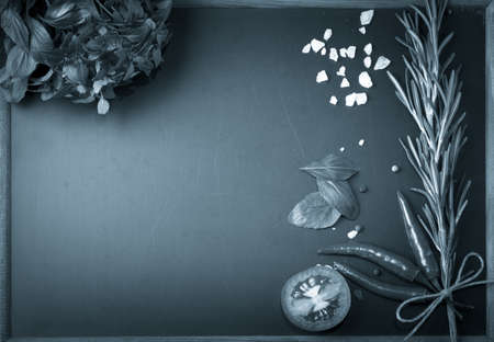 Herbs and spices. basil, red pepper, salt and rosemary on a black background. With space for text