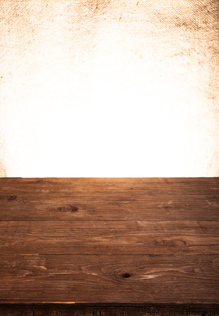 old tabletop and background from a sacking. vertical shotの写真素材