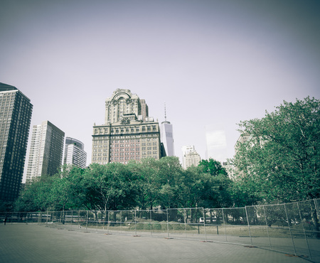 New York City, Battery Park area. Trees and Skyscrapers on a sunny day. Toned.のeditorial素材