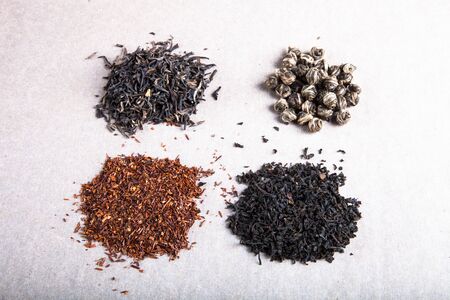 Four kinds of tea on a paper background.の写真素材