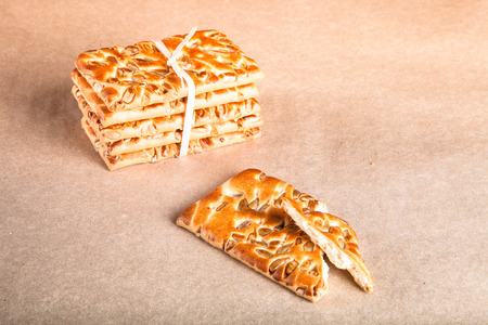 Cookies with seeds tied with a ribbon on light background. Toned.の写真素材