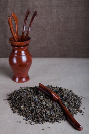 Green tea and set of wooden tools for chinese tea ceremony.の写真素材