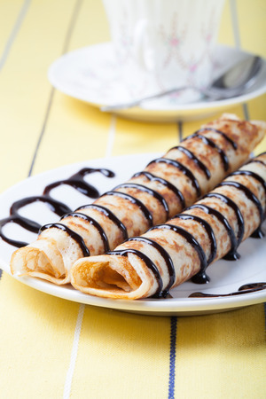 Russian pancakes - blini with chocolate topping.の写真素材