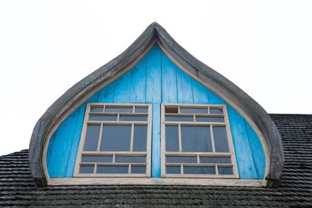 Window on an old wooden roof.の写真素材
