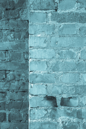 Wall of red bricks. Background. Toned blue.の写真素材
