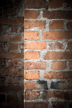 Wall of red bricks. Background. Toned.の写真素材